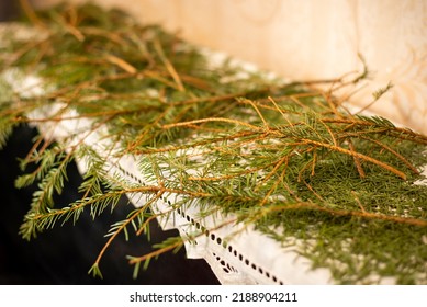 Dried Christmas Tree Branches On The Piano. Cleaning Room After Christmas And New Year Celebration, Mess From Fir Tree Needles