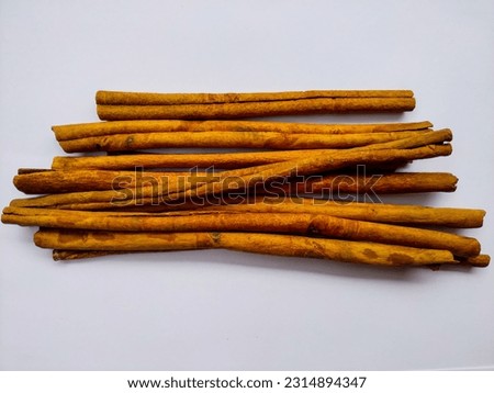 Dried Cinnamon Bark Strips (Cinnamomum Burmannii) Isolated in White Background