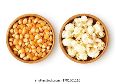Dried corn kernels and popped popcorn in wooden bowls on white background