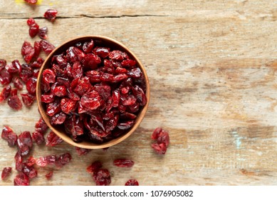 Dried Cranberries In Bowl On Wooden Table 