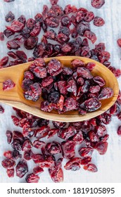 Dried Cranberries On Wooden Spoon.  Delicious And Healthy.  Overhead Vertical Composition.