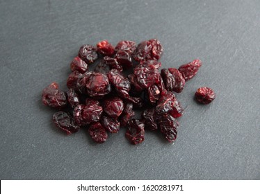 Dried Cranberry  (Vaccinium Subg. Oxycoccus), On Grey Stone Background 