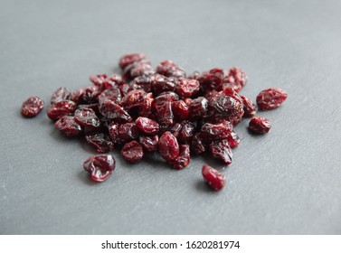 Dried Cranberry  (Vaccinium Subg. Oxycoccus), On Grey Stone Background 