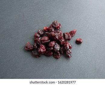 Dried Cranberry  (Vaccinium Subg. Oxycoccus), On Grey Stone Background 