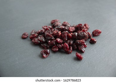 Dried Cranberry  (Vaccinium Subg. Oxycoccus), On Grey Stone Background 