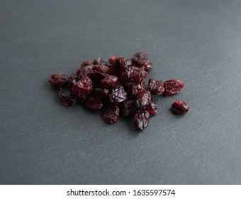 Dried Cranberry  (Vaccinium Subg. Oxycoccus), On Grey Stone Background 