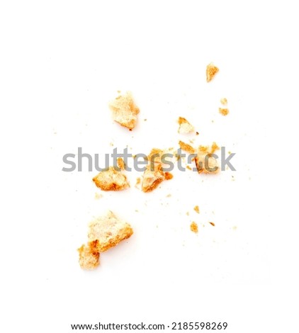 Dried crispy crumbs of white bread isolated on white