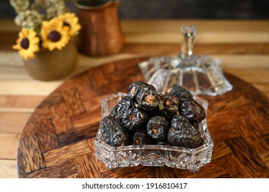 Dried date fruits or in Indonesia known as kurma ajwa, typical dish during Ramadhan. Selective focus. Super food, good to imboost immune system.