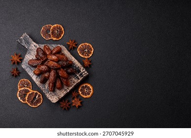 Dried dates in a ceramic plate, arabic food for the ramadan table. Dried dates as a food backdrop for your design.