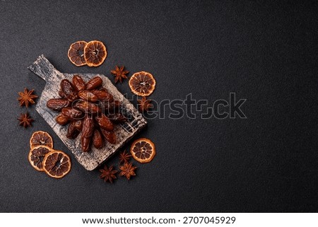 Dried dates in a ceramic plate, arabic food for the ramadan table. Dried dates as a food backdrop for your design.