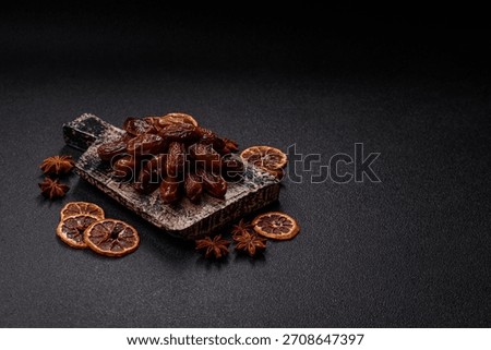 Dried dates in a ceramic plate, arabic food for the ramadan table. Dried dates as a food backdrop for your design.