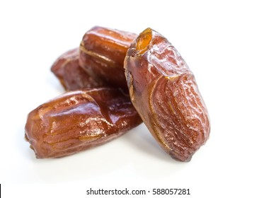 Dried Dates Fruit Over A White Background.