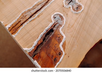 Dried Epoxy Resin In Wood Table, Macro Closeup. Process Of Making A Craft Resin And Wood Table