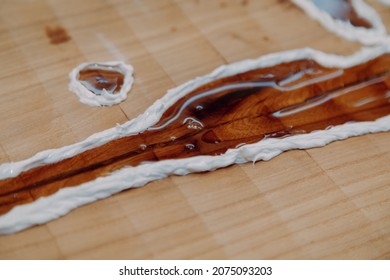 Dried Epoxy Resin In Wood Table, Macro Closeup. Process Of Making A Craft Resin And Wood Table