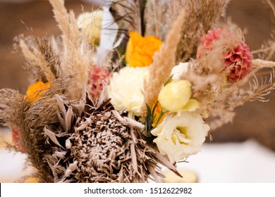 Dried Flowers. Autumn Bouquet Of Flowers In Natural Shades And Dried Flowers. Orange Dahlias, Yellow Roses, Protea, Spikelets