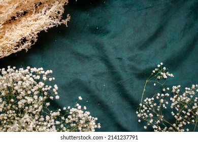 dried flowers on the background Luxury emerald green velour background