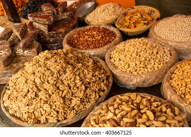 Dried fruit and seeds on a  street market stall - Shutterstock ID 403667125