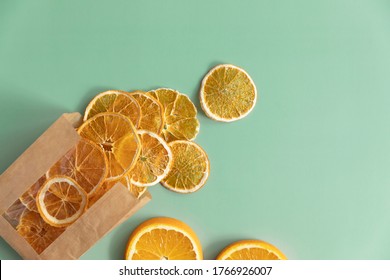 Dried fruits chips packaged in paper packaging. Dietary nutrition. Natural and healthy snack food. Diet chips made from dried oranges. - Shutterstock ID 1766926007