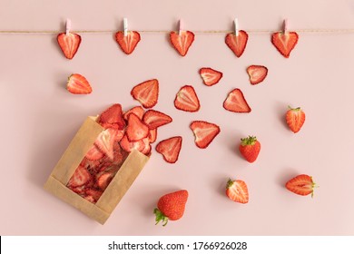 Dried fruits chips packaged in paper packaging. Dietary nutrition. Natural and healthy snack food. Diet chips made from dried strawberries. - Shutterstock ID 1766926028