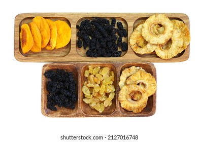 Dried Fruits On Wooden Plates Divided Into Sections. Dried Peach, Mulberry, Raisin And Pineapple. Isolated On White Background.