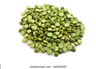 dried green peas halves a hill on a white background