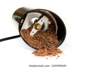 Dried Ground Sumac Powder In A Tipped Over Spice Grinder