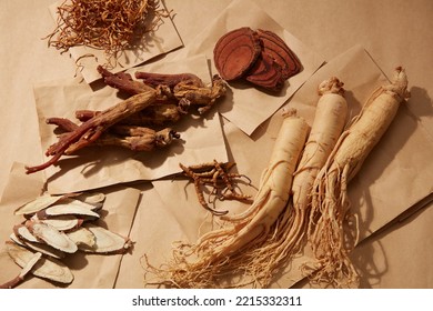 Dried Herbs And Ginseng On A Background Of Brown Paper. One Of The Most Valuable Herbal Treatments From The East