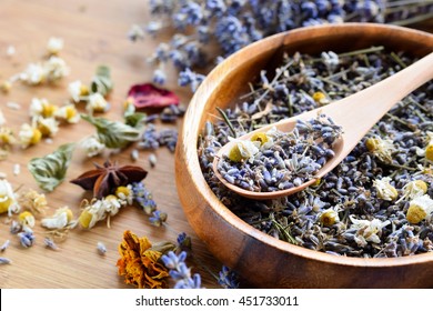 Dried Herbs On Wooden Board