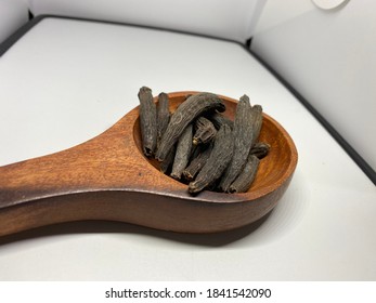 Dried Kapok Buds Or Marathi Moggu (Indian Spice) On A White Background