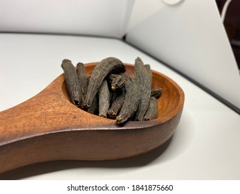 Dried Kapok Buds Or Marathi Moggu (Indian Spice) On A White Background