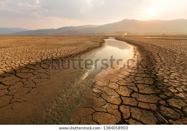 Dried lake and river on summer, Water\
crisis and Drouht impact case or climate\
change.