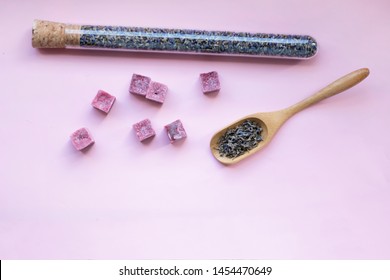 Dried Lavender In Glass And Aroma Purple Lilac Wax Cubes Candles, Wooden Spoon With Cooking Lavender  Lying On Pink Background, Aromatherapy, Close Up, Copy Space