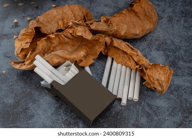 Dried leaves and cigarettes close-up; fine details and very high resolution for backgrounds.