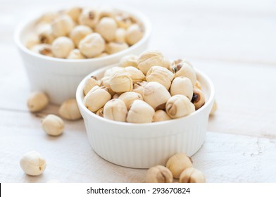 Dried lotus seeds on white background