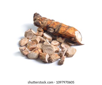 Dried medicinal herbs raw materials isolated on white. Root of Acorus calamus, also called sweet flag or calamus.