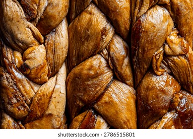 Dried melon braid texture macro close up. Macro background texture of sweet dried melon slices braided together on close up organic pattern