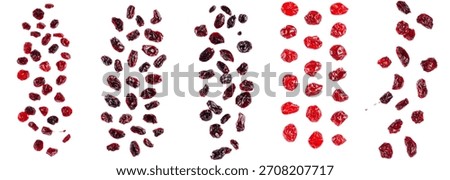 Dried mixed fruit falling, selecting red dried cranberries and dark raisins, healthy snack food on white background