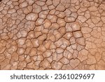 Dried mud surface - dry riverbed background. Drought in Morocco.