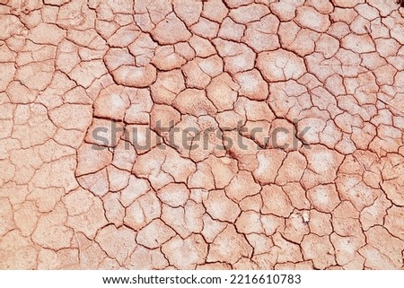 Dried mud surface - dry riverbed earth texture. Drought in Morocco.