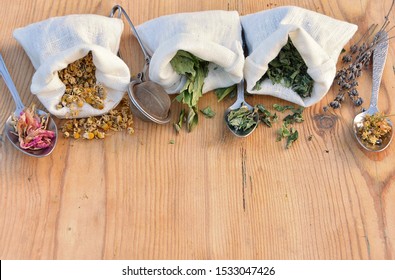 Dried Natural Herbs In Linen Bags And Spoons For Herbal Tea And Remedies, Alternative Medicine, Home Apothecary, Phytotherapy Concept.