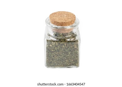 dried nettle herb or in latin Utricae folium in a glass jar isolated on white background. medicinal healing herbs. herbal medicine. alternative medicine