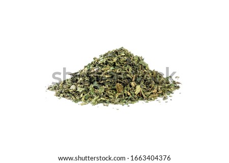 dried nettle herb or in latin Utricae folium heap of isolated on white background. medicinal healing herbs. herbal medicine. alternative medicine