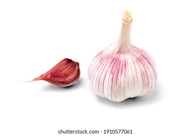 Dried onion of pink garlic and one clove of garlic isolated on a white background. A popular vegetable crop with a sharp taste and pungent smell - Shutterstock ID 1910577061
