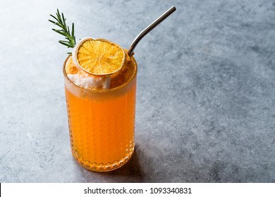 Dried Orange Cocktail With Foam, Rosemary And Metal Straw.