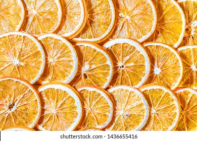 Dried Orange Slices (chips) Background. Dehydrated Crispy Fruit Slices. Heap, Pile Of Sun Dried Crunchy Oranges. Healthy Meal Snack. Close Up. Top View