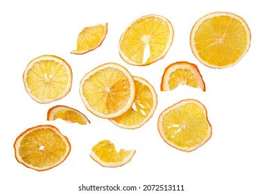Dried orange slices falling close-up on a white background, cut out. Isolated fruit chips