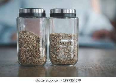 Dried Oregano Shaker Bottle On Table In A Pizza Place