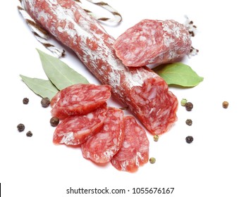 Dried organic salami sausage on white background - Shutterstock ID 1055676167
