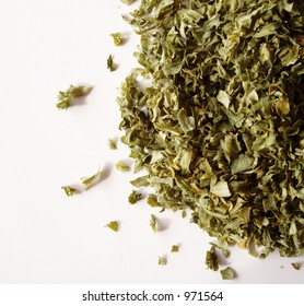 Dried Parsley Flakes On White Background