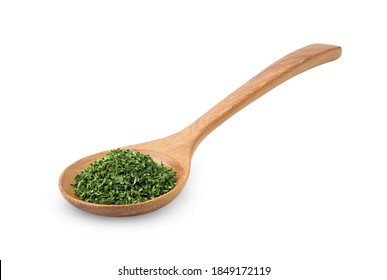 Dried Parsley In Wood Spoon Isolated On A White Background